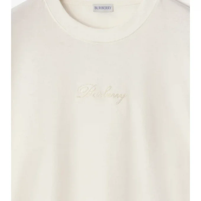 Camiseta de algodón con logotipo cursivo y estampado de cuadros