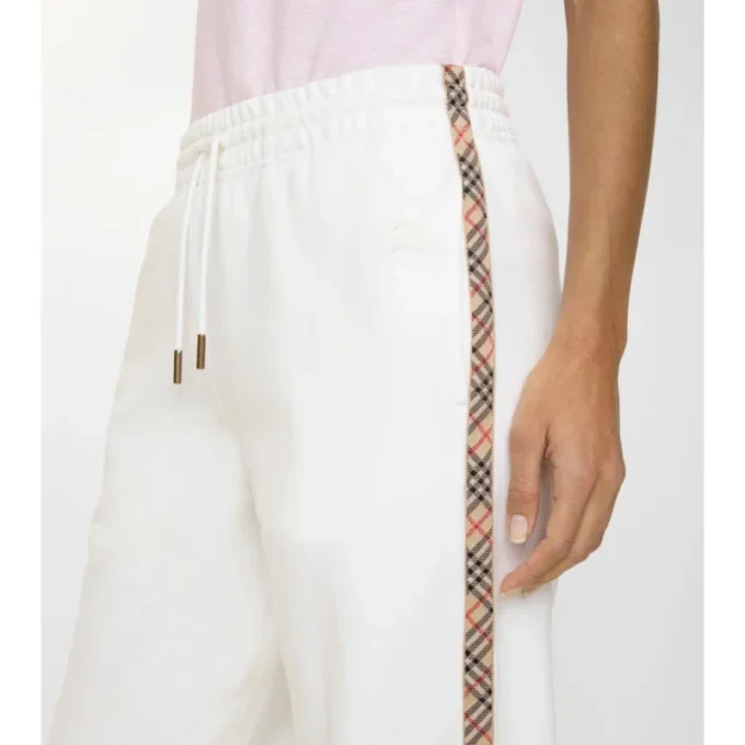 Pantalones deportivos de algodón con ribetes de cuadros Pantalones deportivos de algodón con ribetes de cuadros