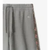 Pantalones deportivos de algodón con ribetes de cuadros Pantalones deportivos de algodón con ribetes de cuadros