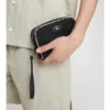 Pochette avec ribete de cuadros petits Pochette avec ribete de cuadros petits