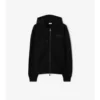 Sudadera con capucha y cremallera de algodón con el logotipo en cursiva y estampado de cuadros Sudadera con capucha y cremallera de algodón con el logotipo en cursiva y estampado de cuadros