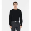 Suéter de lana con ribetes a cuadros Suéter de lana con ribetes a cuadros